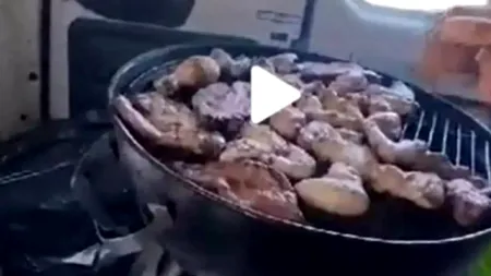 Au făcut grătarul în mașină, după ce i-a prins ploaia la iarbă verde (VIDEO)