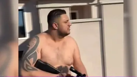 Cine este viteazul care a ieșit pe jumătate dezbrăcat cu arma în mână după percheziția la domiciliu