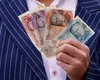 Un tată singur din Anglia, supraviețuitor al cancerului, își anunță fiul că a câștigat un milion de lire sterline