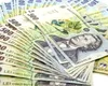 Salarii fabuloase pentru șefii de la stat, sărăcie și tăieri pentru românii de rând