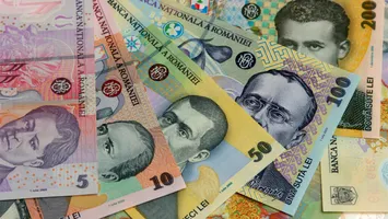 Moneda națională începe săptămâna cu depreciere. 4,9767 lei pentru un euro