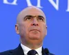 Ilie Bolojan, „asasinul” magiei capitalismului. Mircea Dinescu, cunoscut publicist, a găsit și pedeapsa celui considerat vinovat pentru starea de fapt!