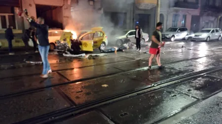 Un taxi a luat foc după ce a intrat într-un autobuz STB. O persoană este decedată, alte 4 la spital