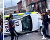 Scandal uriaș în Leeds, între sute de români și poliția britanică. O mașină de poliție răsturnată (Video)